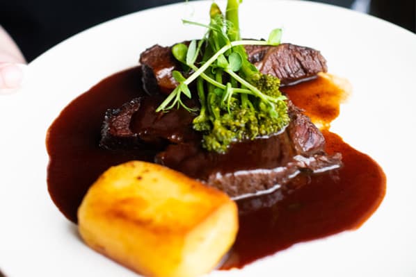 A beef main course plated at Temple House