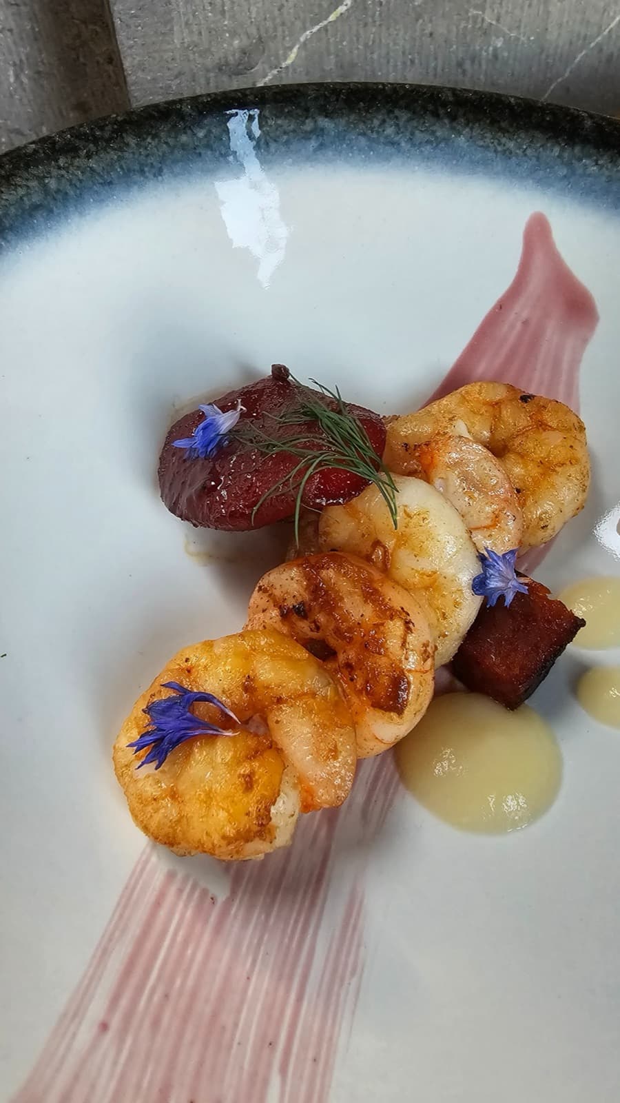 King prawn and chorizo starter plated at Temple House