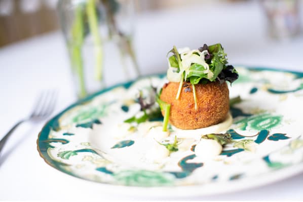 A single place setting of salmon fishcake starter at Temple House