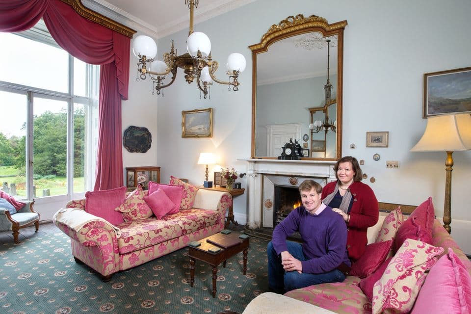 Roderick and Helena Perceval in the drawing room at Temple House