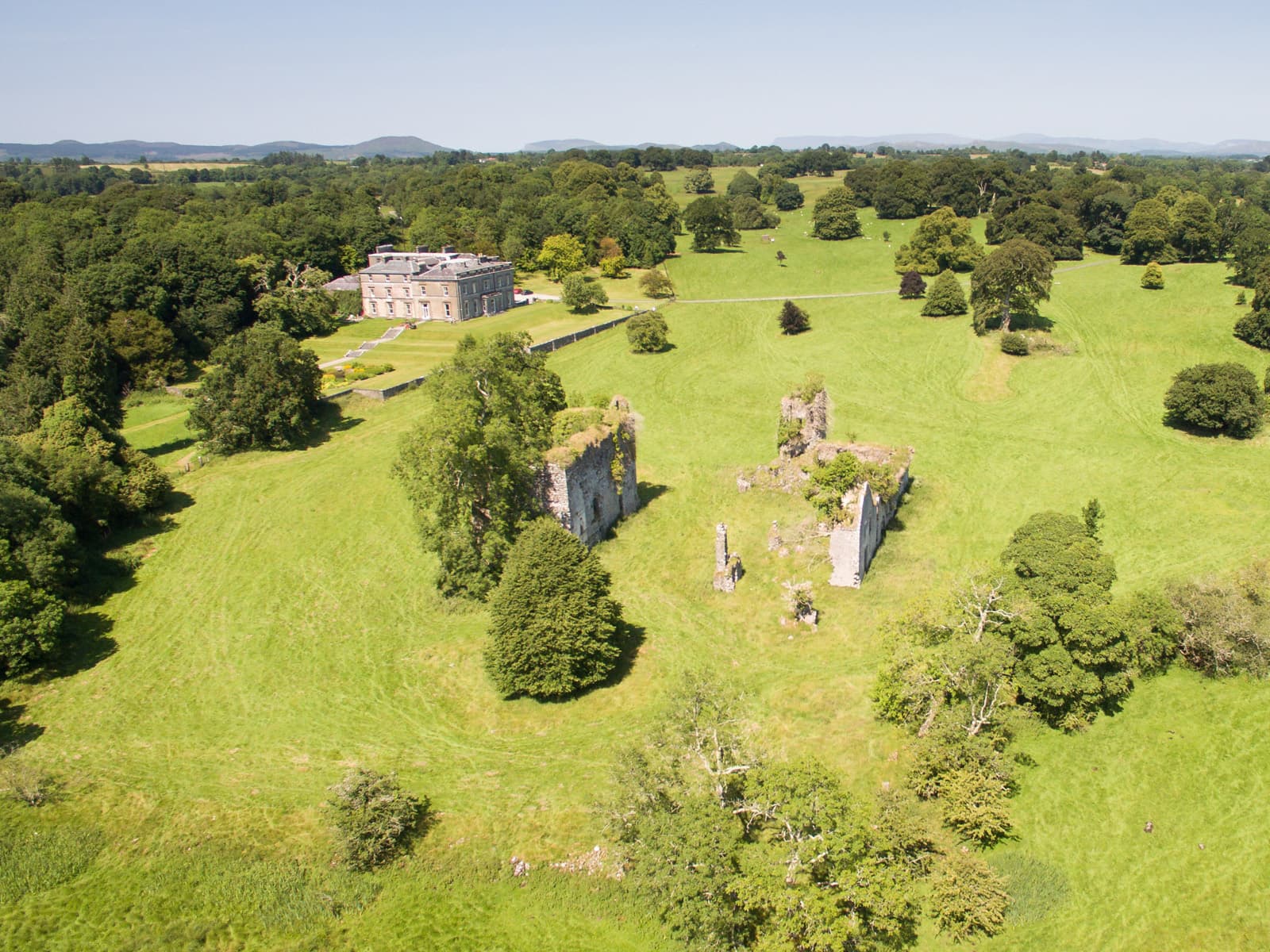 Aerial view of the Temple House estate — the manor, gardens, castle ruin and lake in County Sligo
