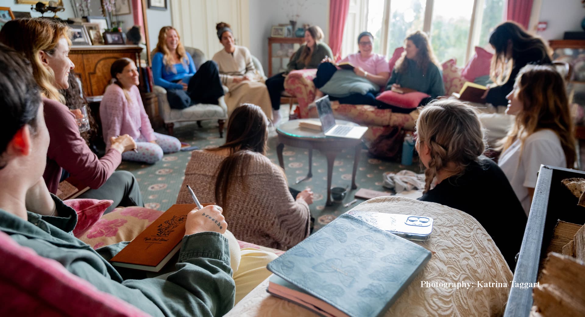 Retreat group working together in a sitting room at Temple House