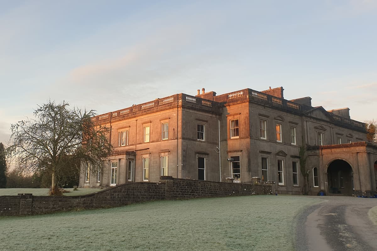Temple House at dawn — the Big House across the parkland