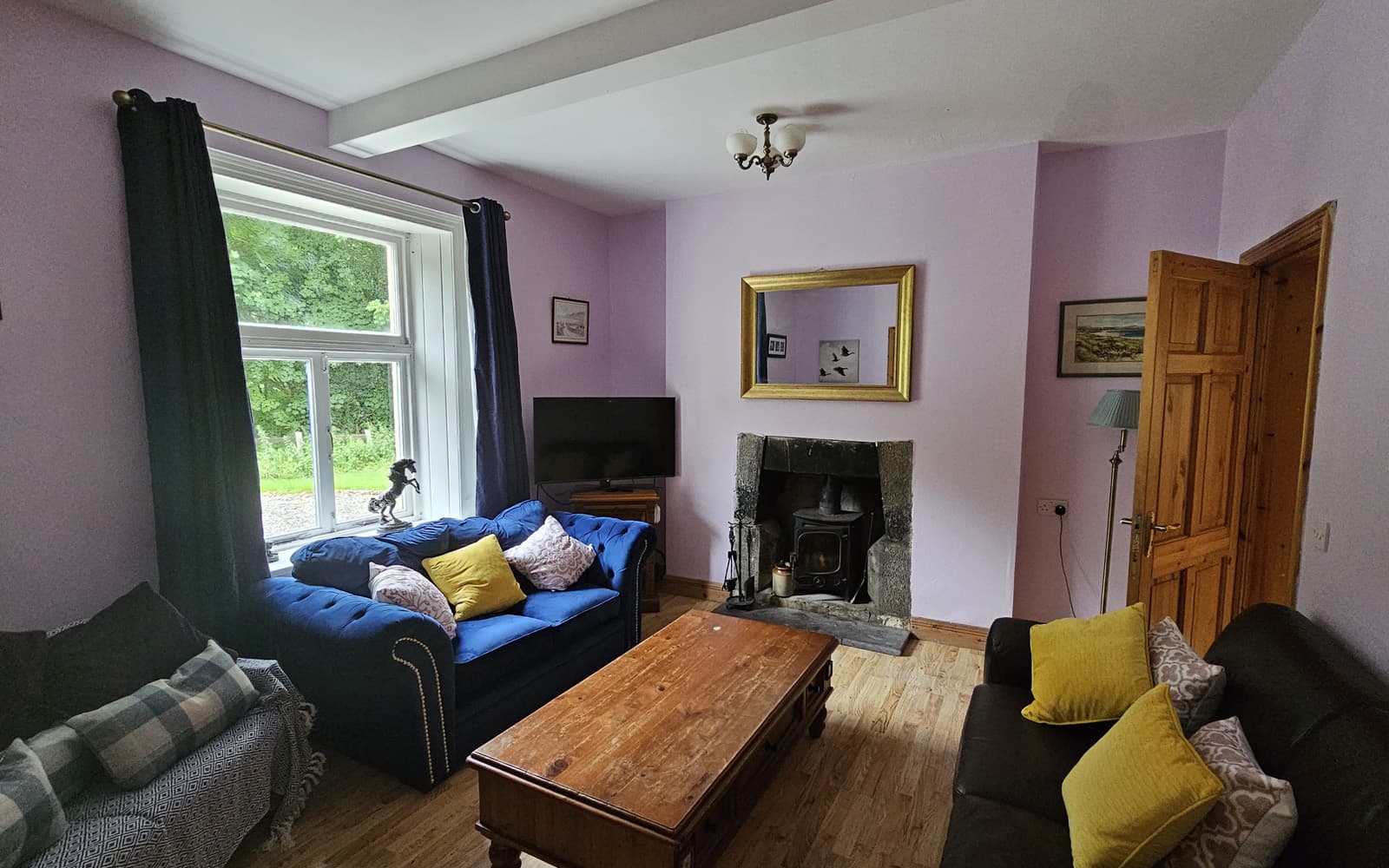 The Gardener's Cottage living room with open fire