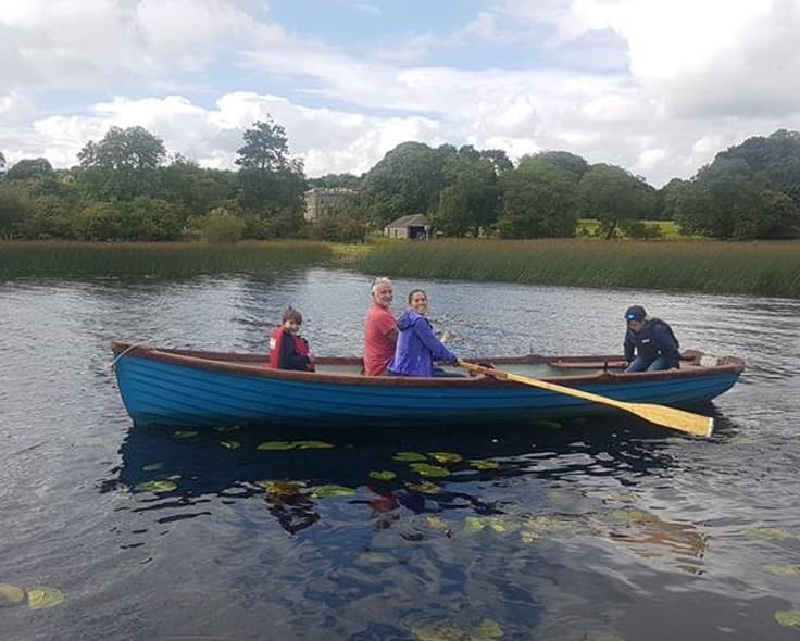 Family in a rowing boat on the lake at Temple House, County Sligo — free for resident guests