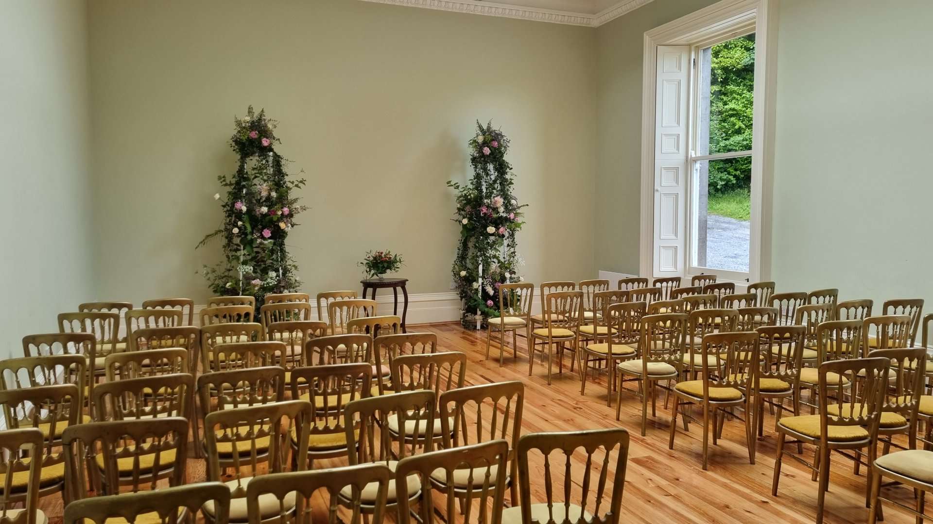 Ceremony room floral arches at Temple House