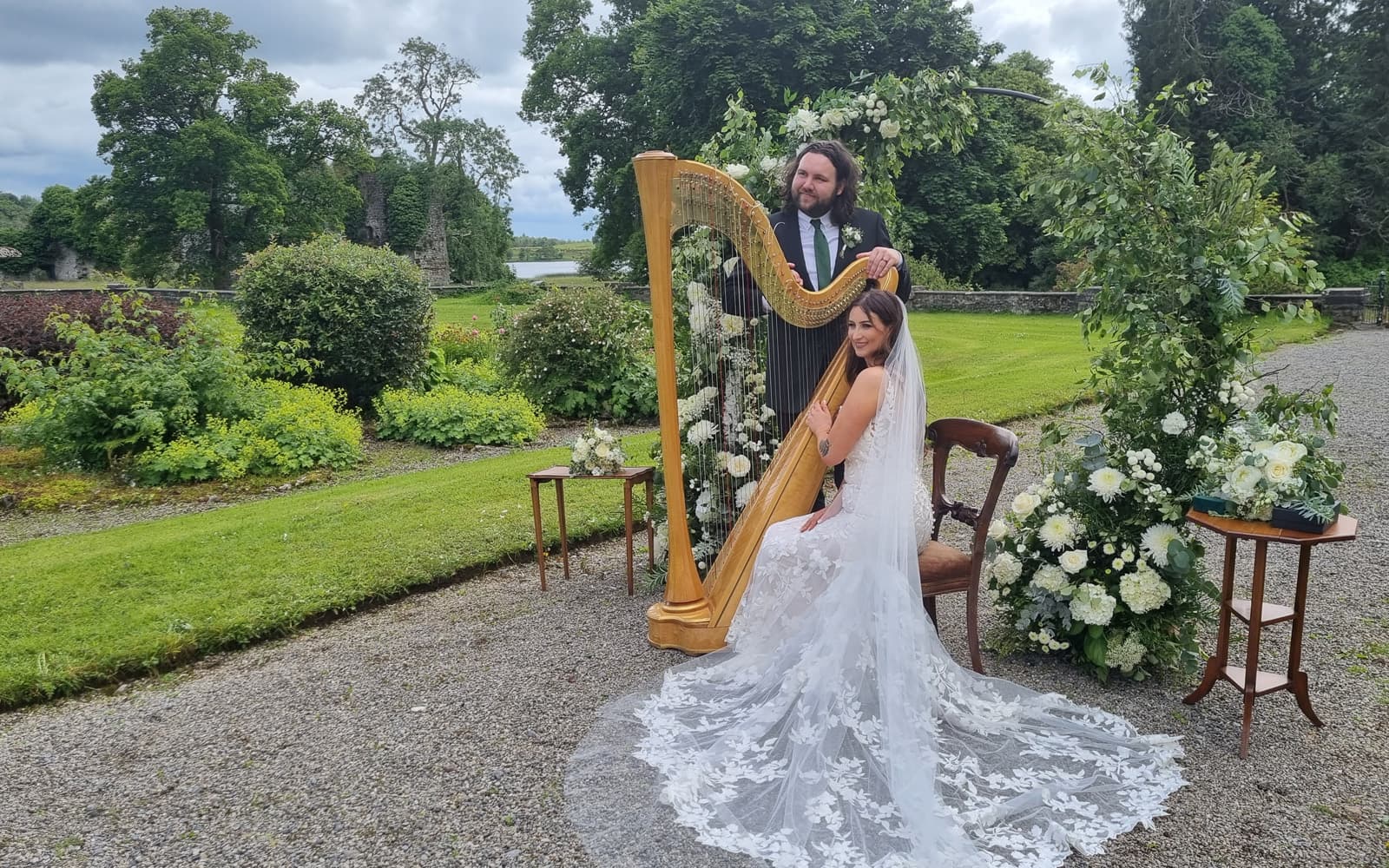 Bride playing the harp at an elopement wedding at Temple House