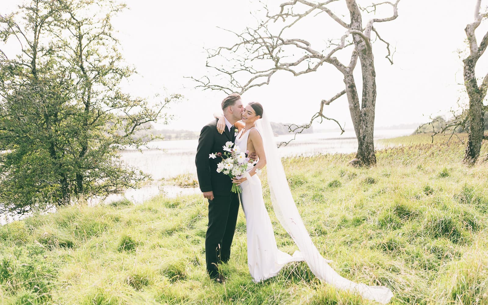 Wedding couple lakeside at Temple House