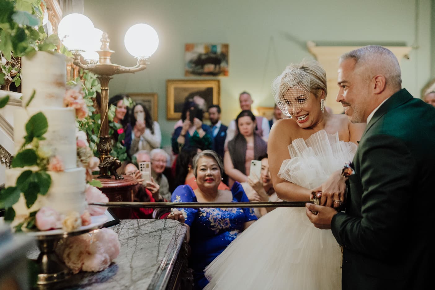 Couple cutting their wedding cake at Temple House